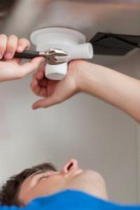 an Eerie plumbing professional is repairing a clogged sink